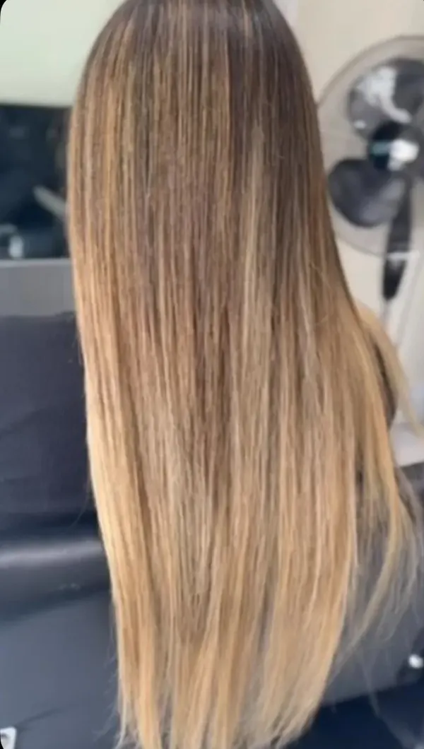 Long straight hair with blended highlights and bead extensions