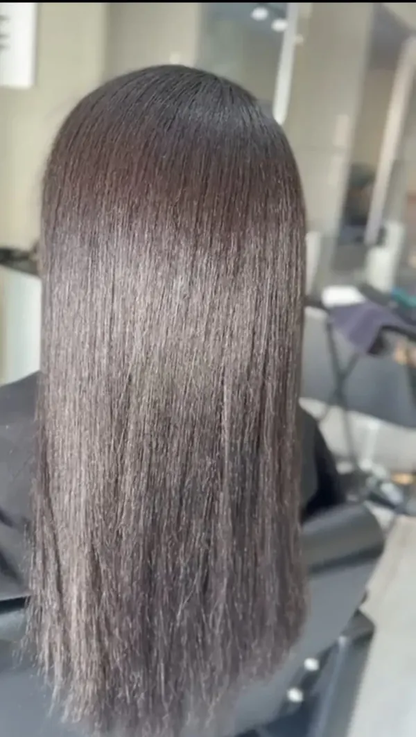 Glossy straight brown hair after a black-to-brown colour change